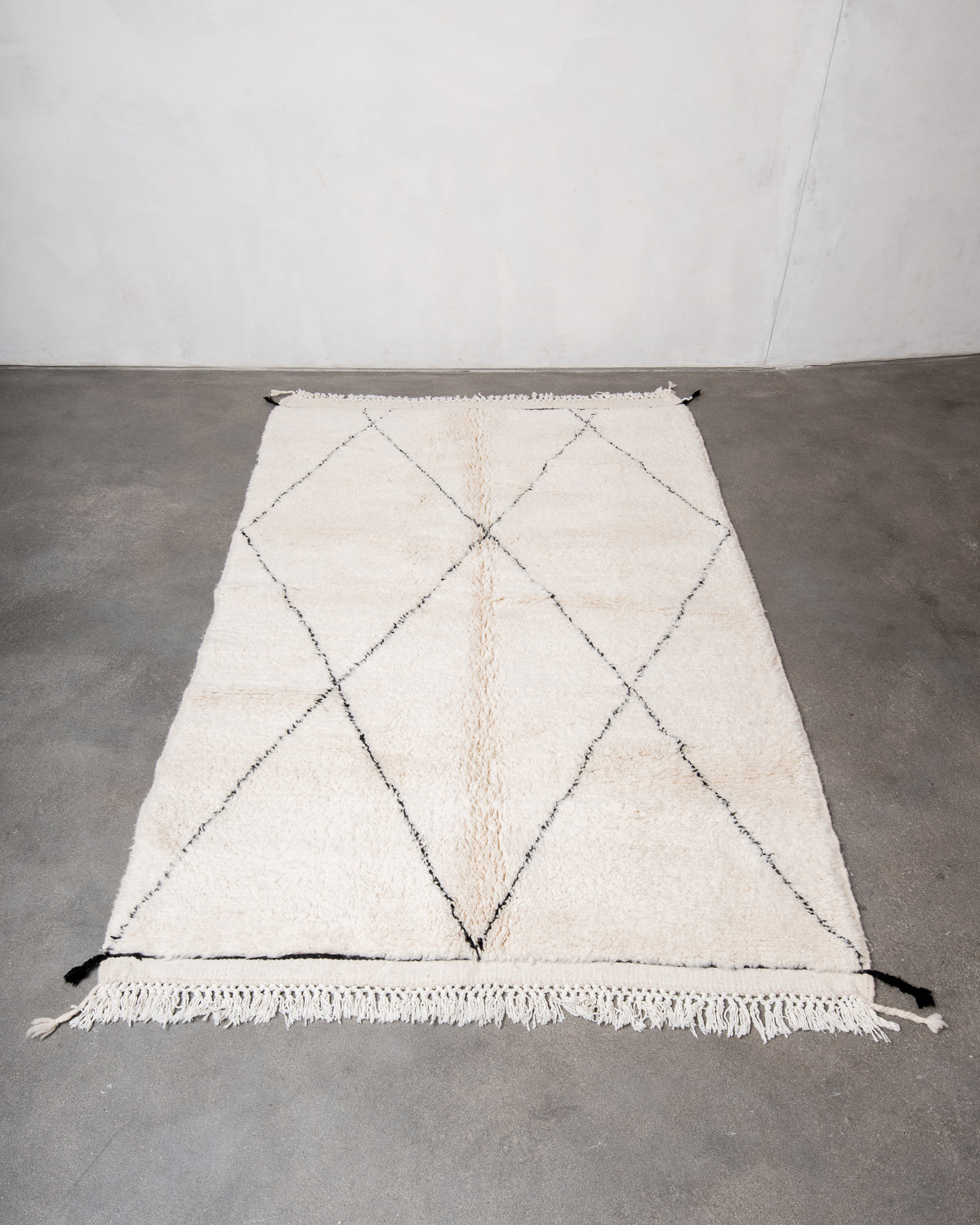 Modern, designer, handcrafted Berber rug from Morocco. Beniourain carpet with minimalist design, natural wool pile and a fluffy texture.